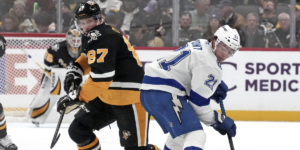 Sidney Crosby battles Brayden Point.